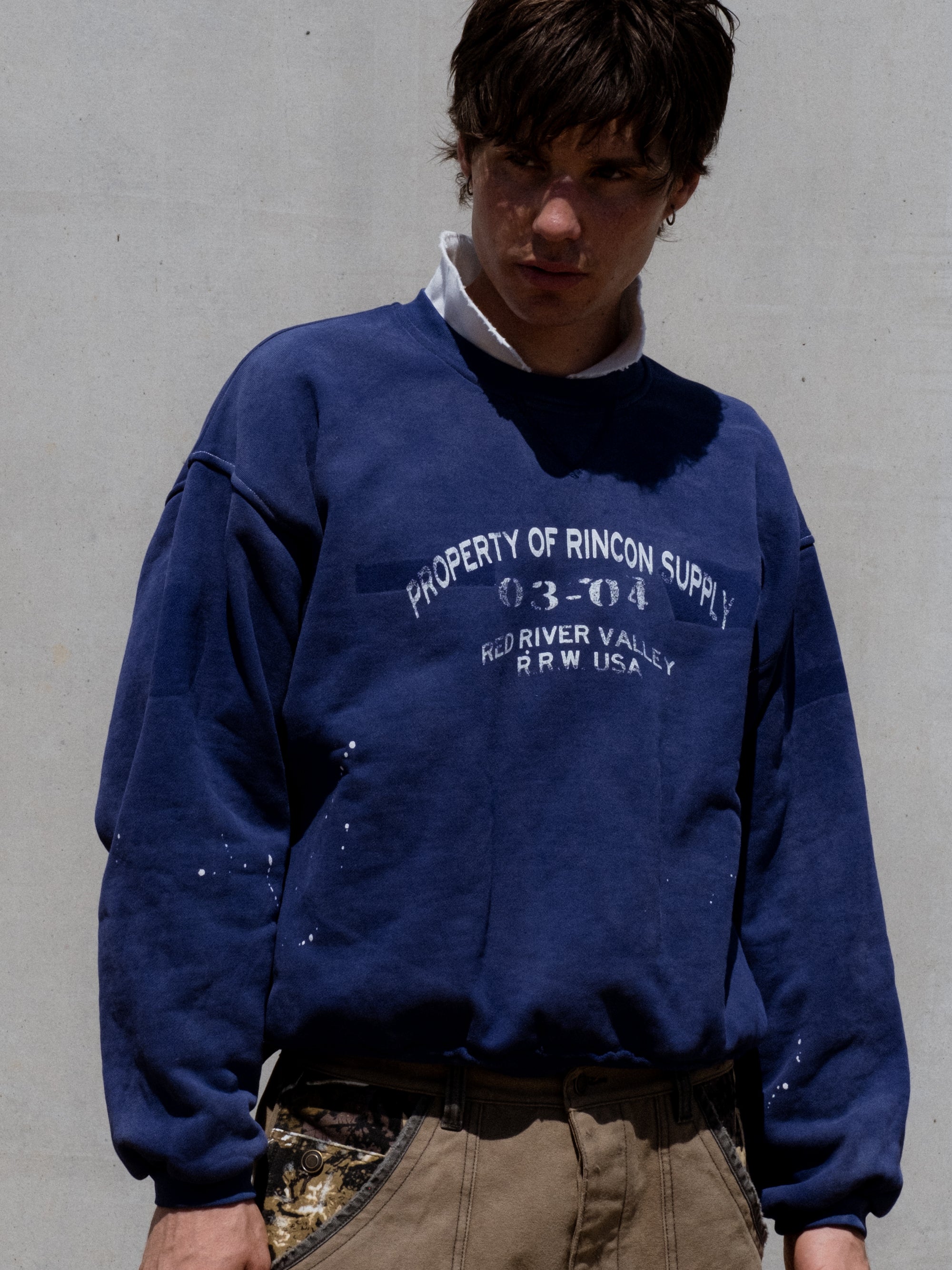 Ranger Crewneck Navy - paint splatter and sun wash finish close-up - Rincon